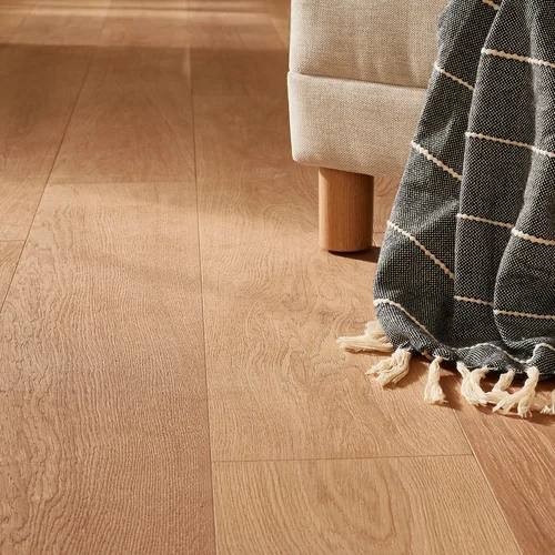 blanket laying on hardwood floors