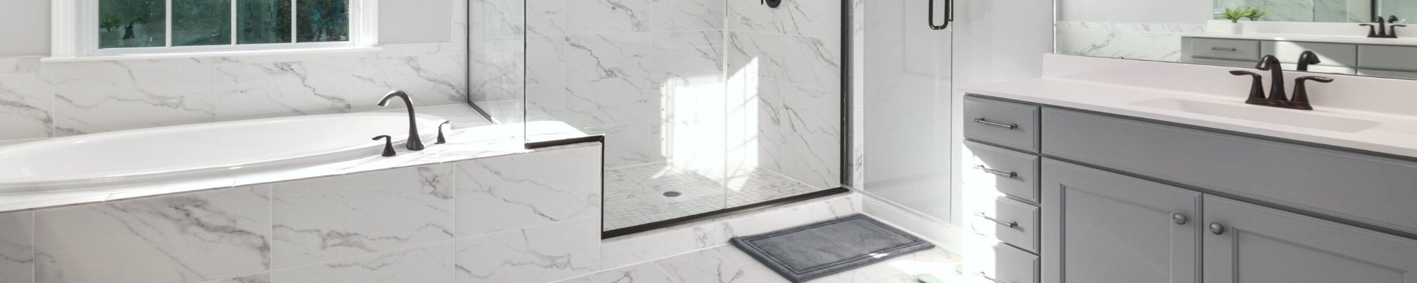 transitional style bathroom with grey vanity and marble porcelain tile flooring